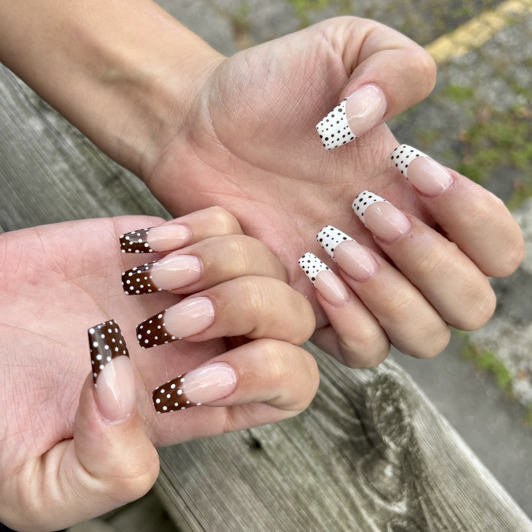 Brown and white polka dot French tip acrylic nails by TwentyOne Nails London Ontario