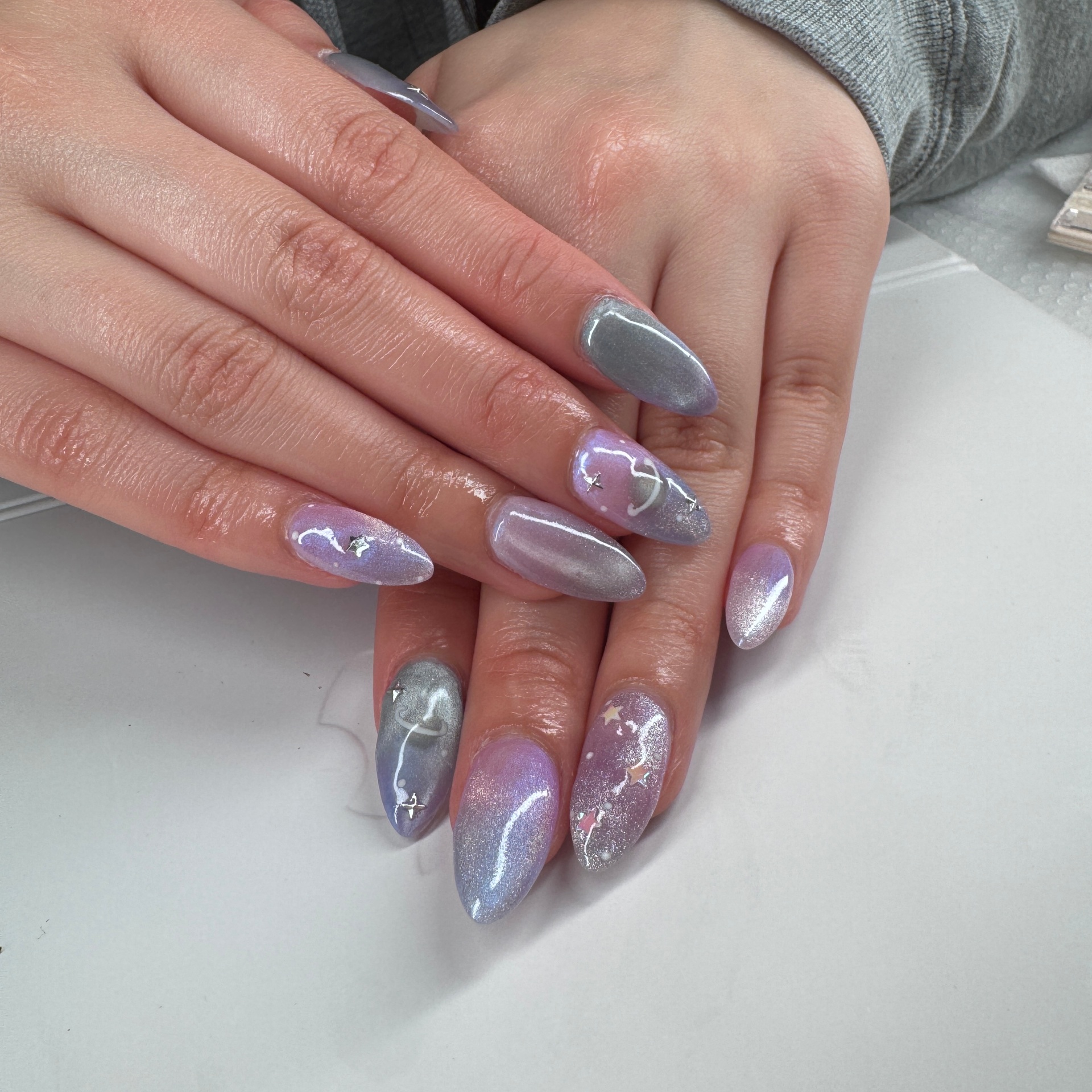 Lilac and silver chrome almond nails with star accents London Ontario