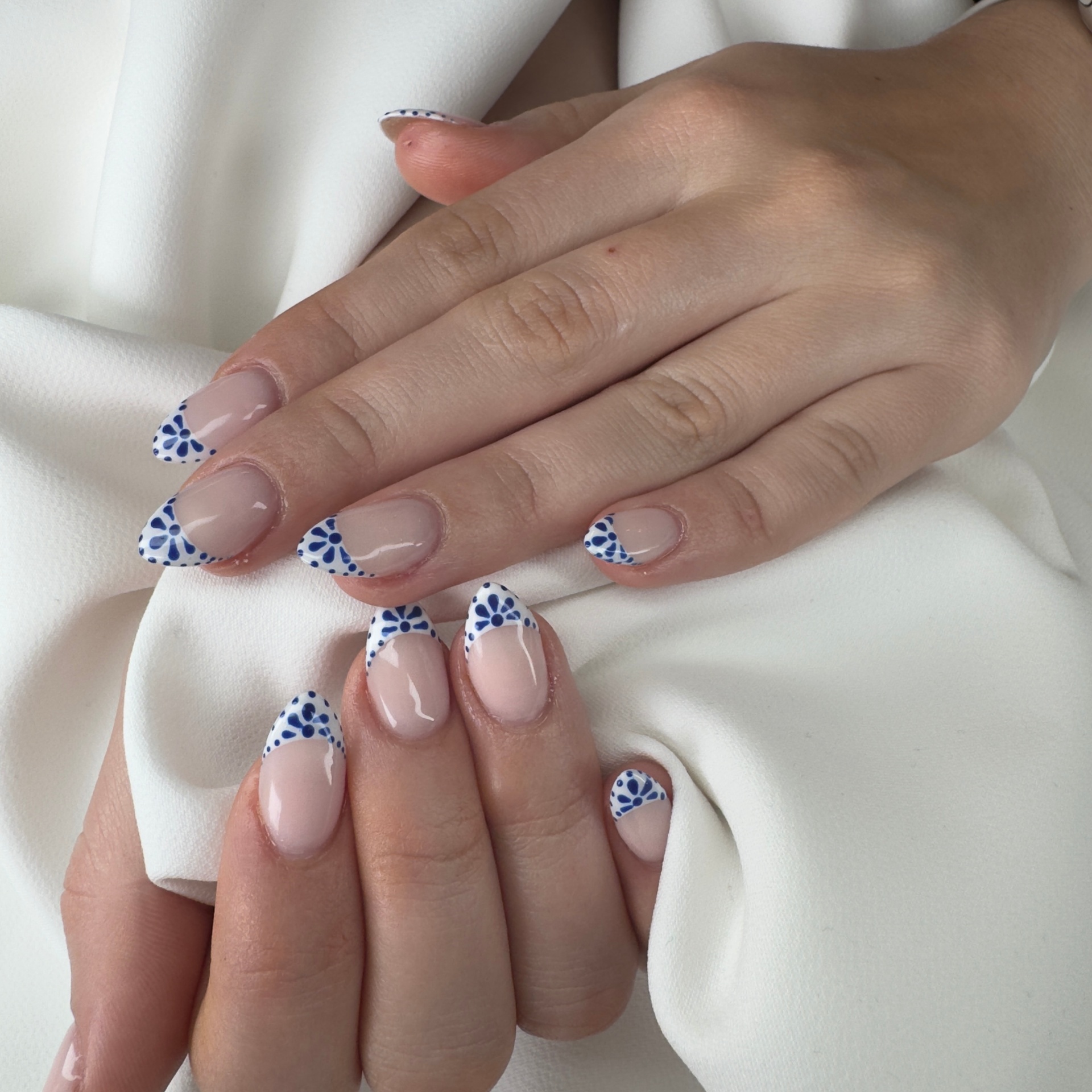 Hand-painted blue floral French tip nails London Ontario